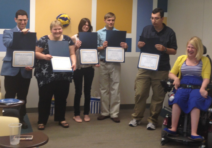 Kylie with the first graduating class of Ambassadors at All About Developmental Disabilities (AADD).