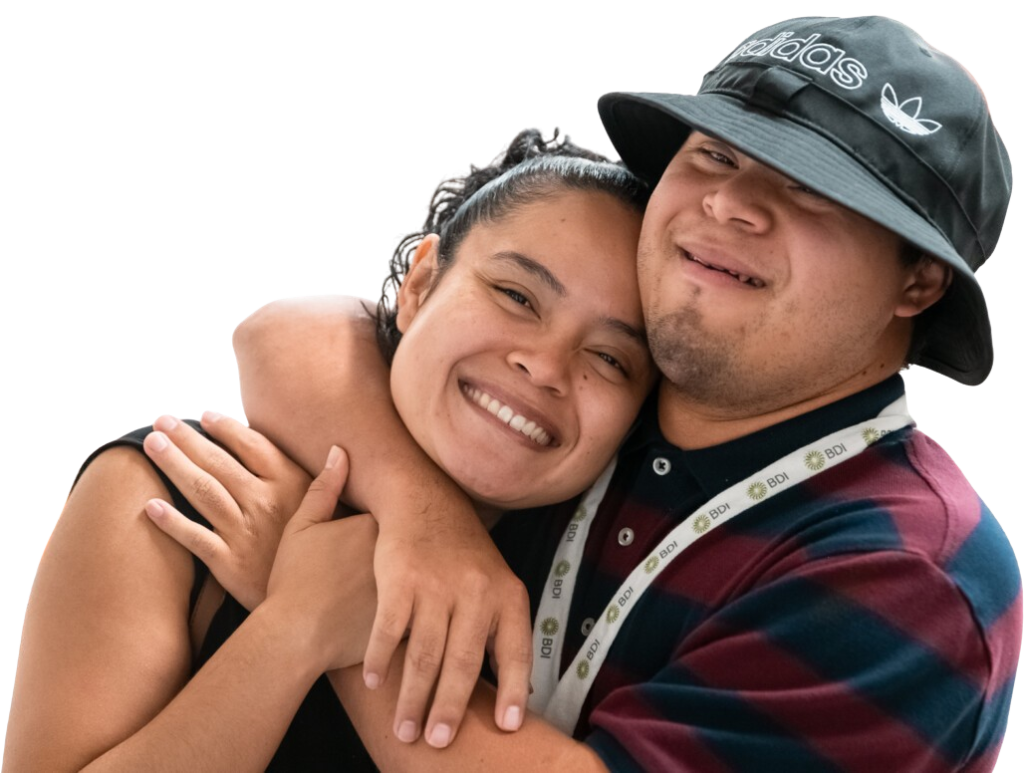 A young man and woman hugging and smiling