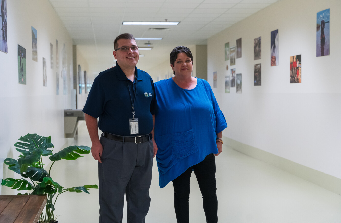 Sutton, a BDI employee, and his stepmom Beth Beall at a jobsite where he provides janitorial support.