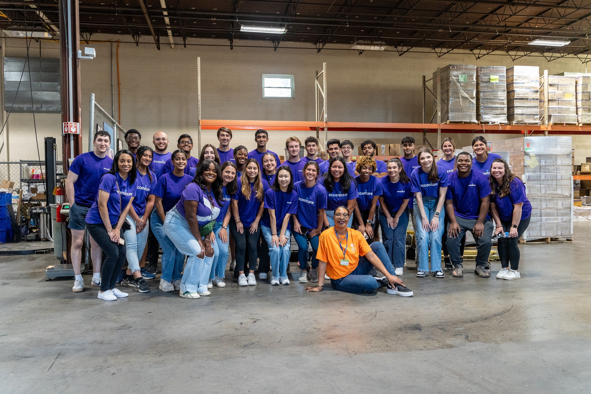 Volunteers from Accenture at the BDI Atlanta Warehouse with Monique Bell, Manager, Community & Constituent Integration at BDI.