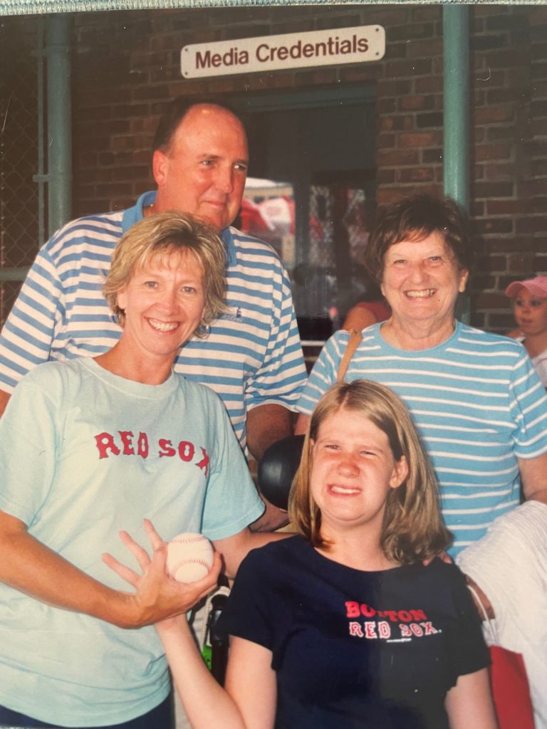 Kylie with her family at a Red Fox baseball game. 