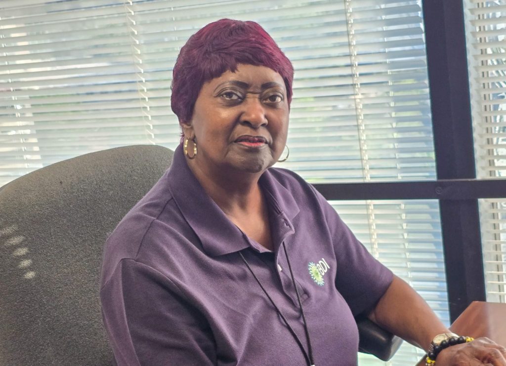 Bertha working on her computer at the IRS mailroom