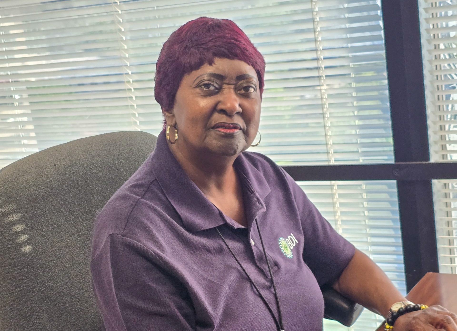 Bertha working on her computer at the IRS mailroom